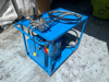 Portable power pack mounted to cart.